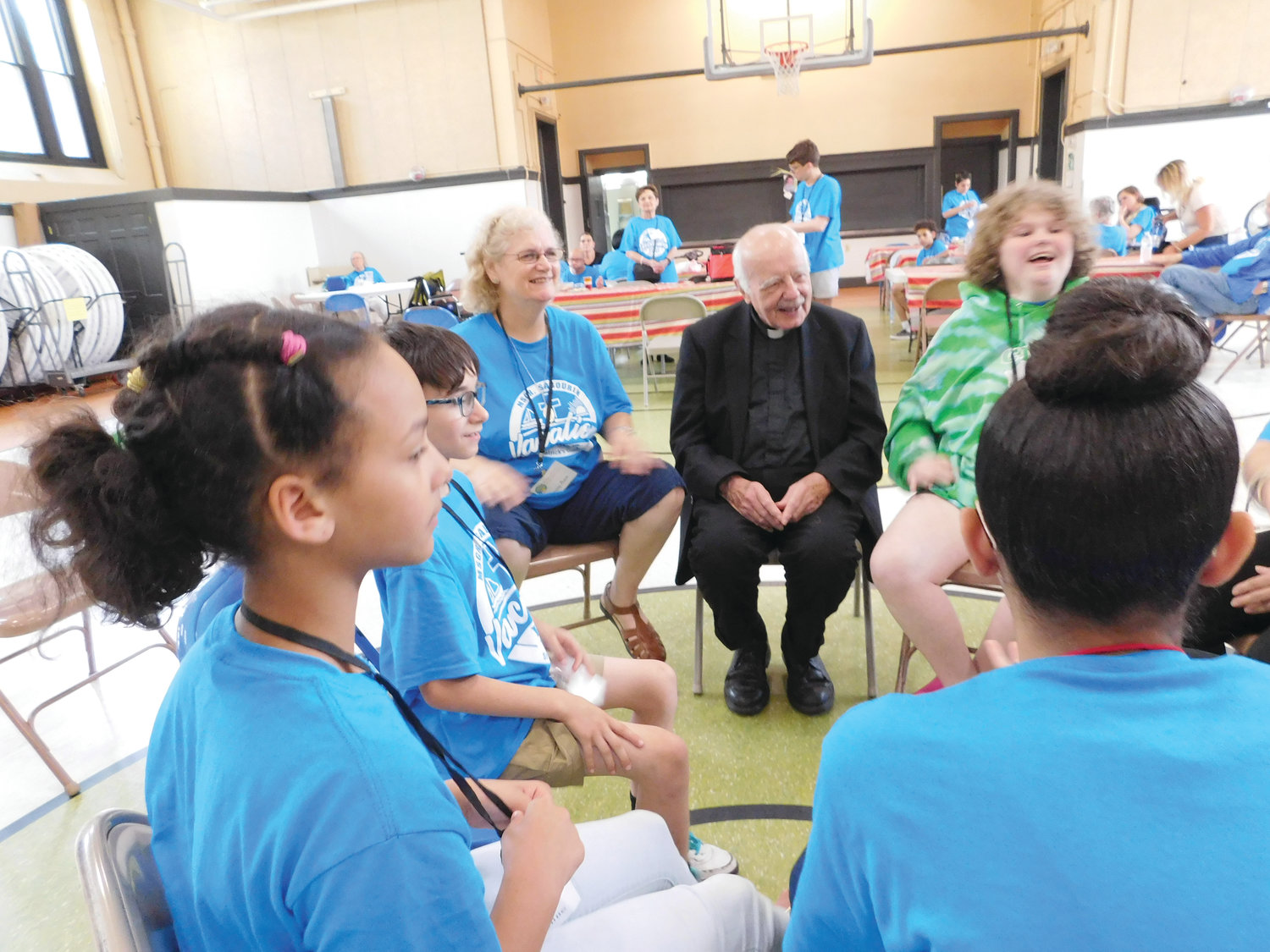 The camp’s namesake, Msgr. Gerard Sabourin, smiles with attendees during a recent visit to the camp. In the 1960’s, Msgr. Sabourin established the Office of the Apostolate for the Handicapped, the precursor to the Office of the Apostolate for People with Disabilities.